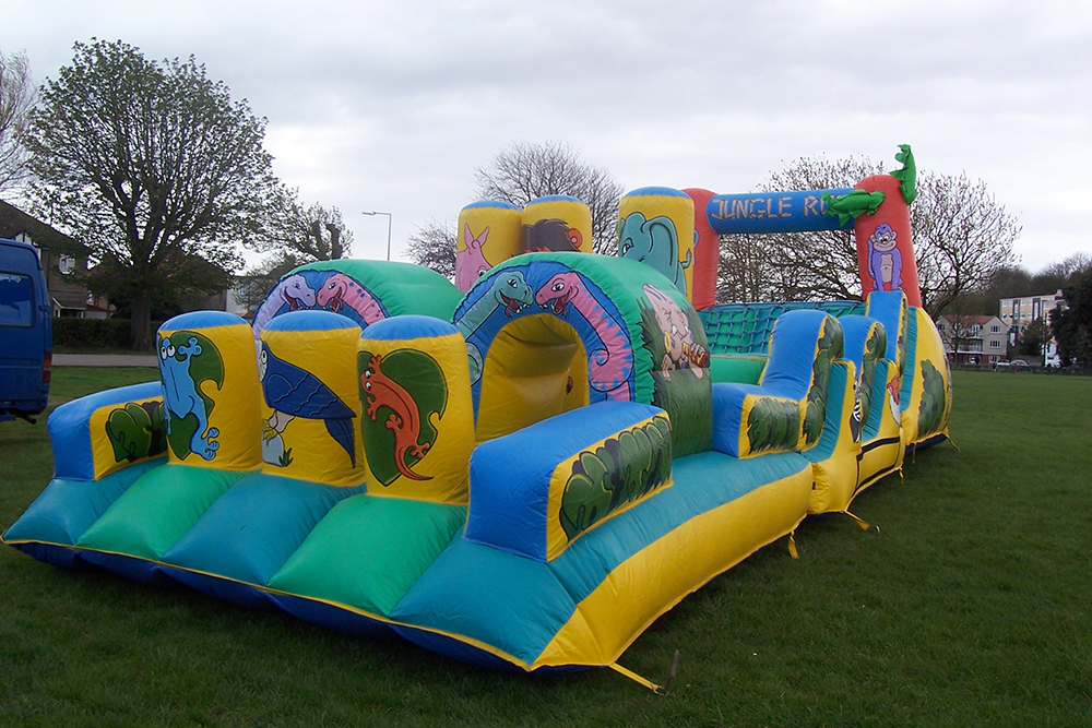 One of our most popular inflatables, particularly for corporate events - the Jungle Run Assault Course is great for the older children! Run through obstacles, climb through tunnels, and try to climb while racing friends and family with this endlessly fun Assault Course! Suitable for children up to 11 years.